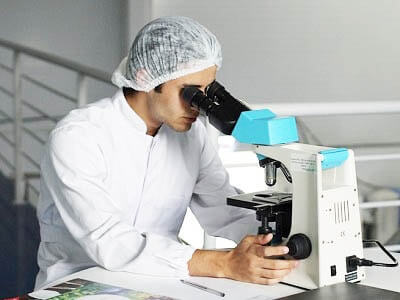 scientist-man-whitecoat-look-microscope.jpg
